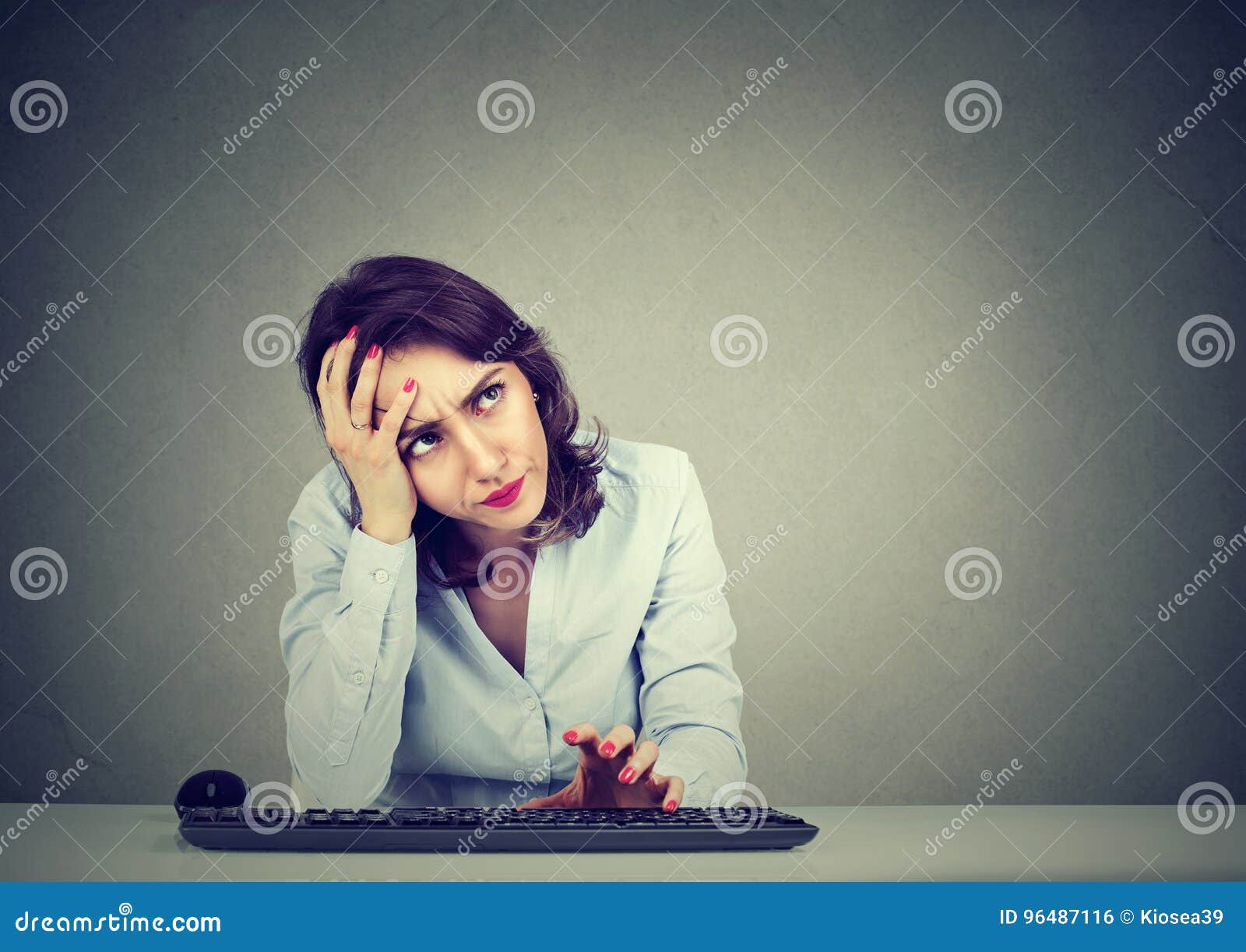 desperate woman trying to log into her computer forgot password