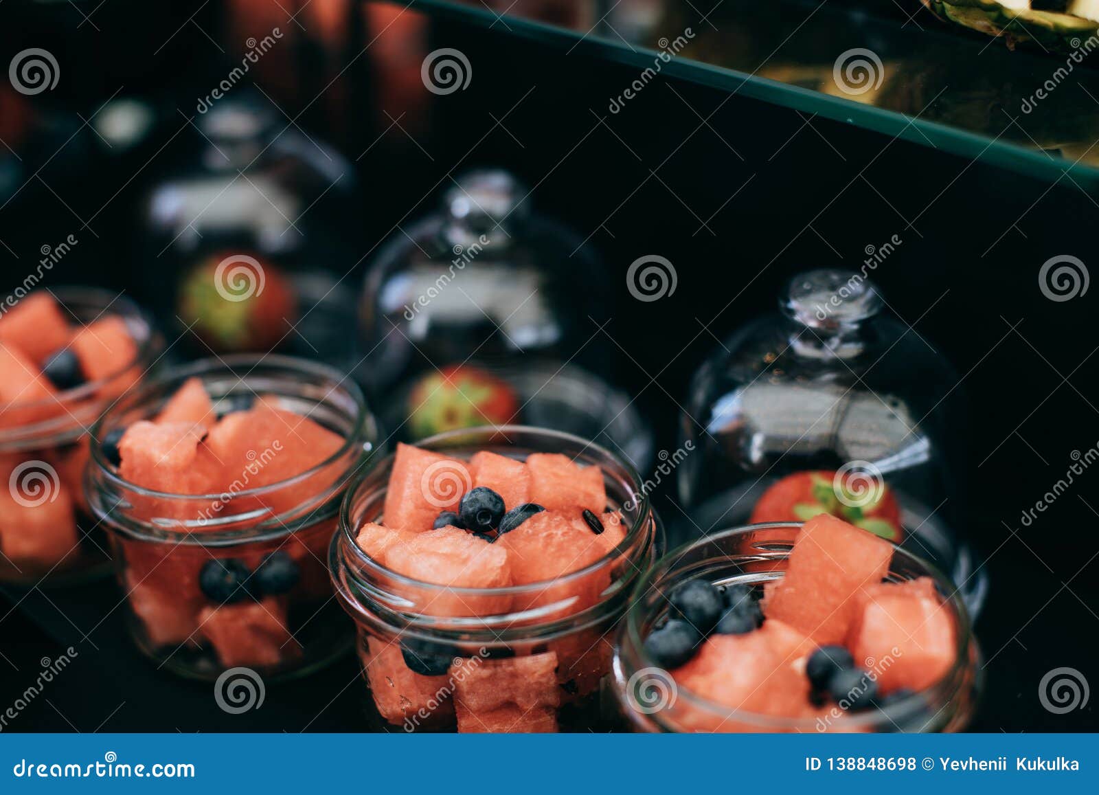 Dessert of Fresh Fruit on the Table. Watermelon, Grapes, Berries Stock