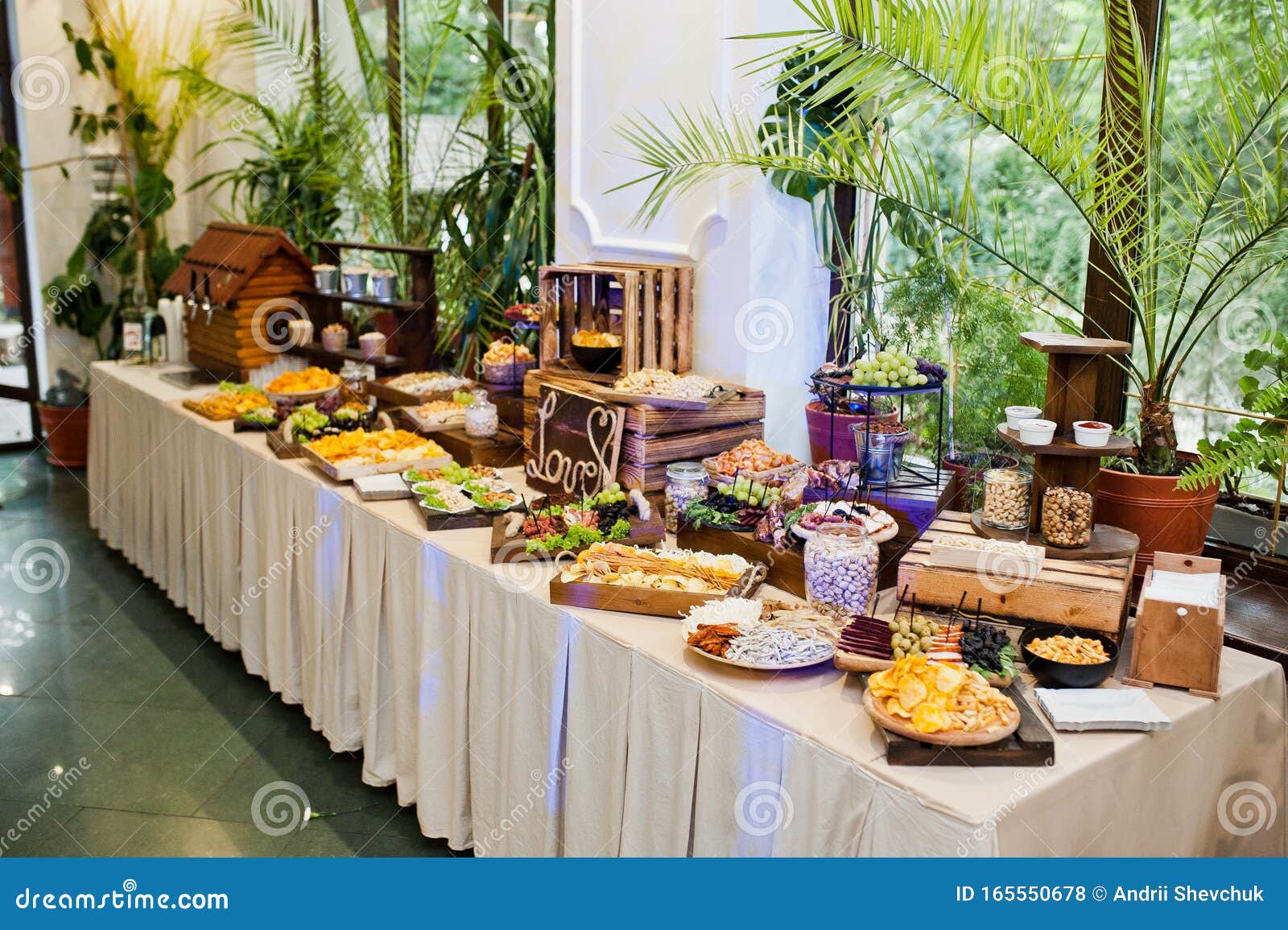 Dessert Table of Delicious Snacks on Wedding Reception Stock Photo