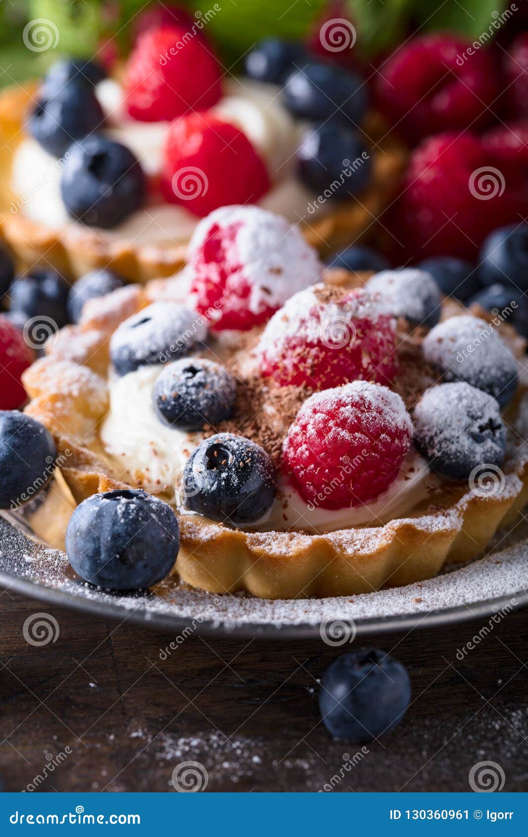 Dessert Tarts with Raspberries and Blueberries on a Wooden Tabl Stock ...