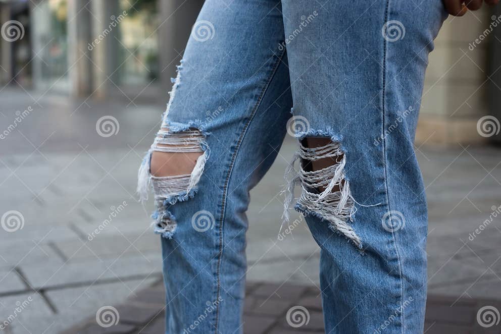 Destroy Blue Jeans on Young Woman in the Street Stock Photo - Image of ...