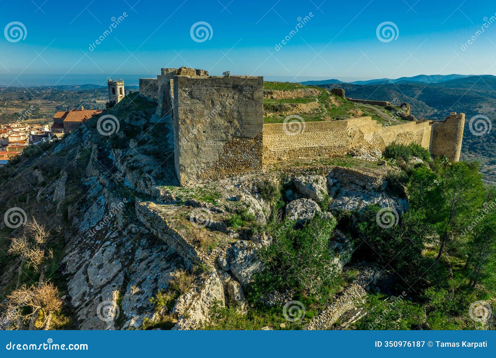 aerial view of cervera del maestre castle with ruined excavated inner building remains in spain