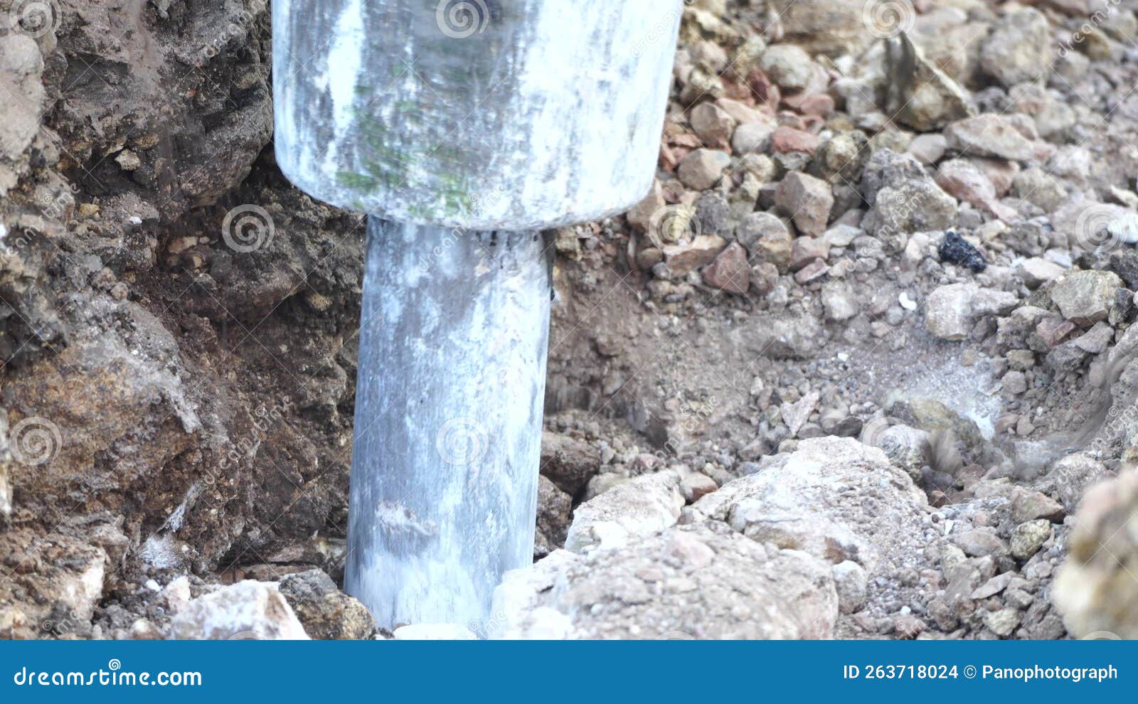 Loud Destruction of Solid Soil Rock with Pneumatic Jackhammer Excavator