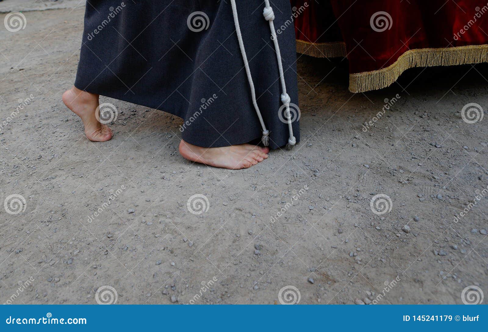 Detail on a Barefeet Penitent during an Easter Holy Week Procession in ...