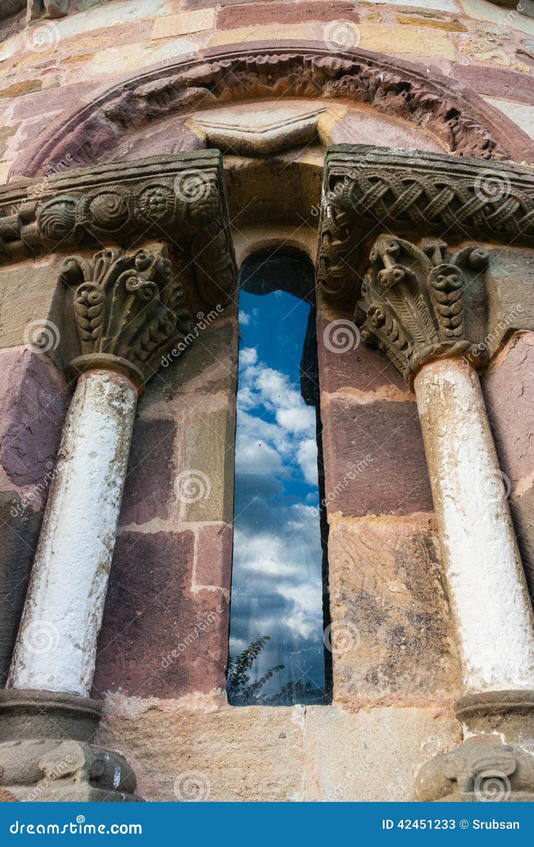 detail of beautiful window in romanesque abse in san esteban de