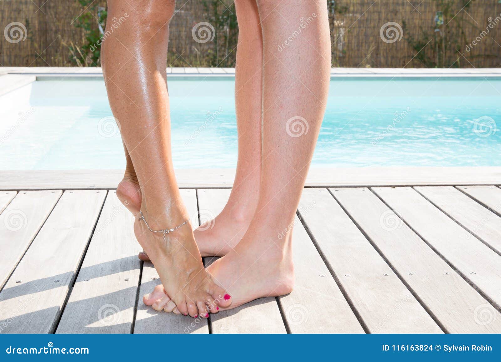 Detail Body Couple with Leggs Man and Woman Front of Pool, Stock