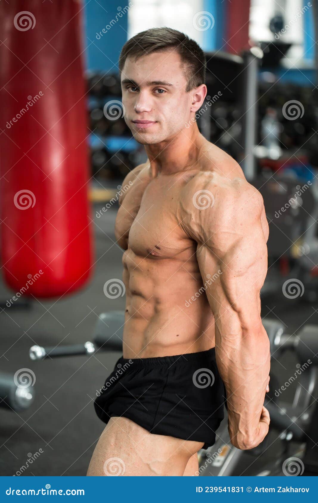 Detail of a Bodybuilder Posing in the Gym Side Chest. Stock Image
