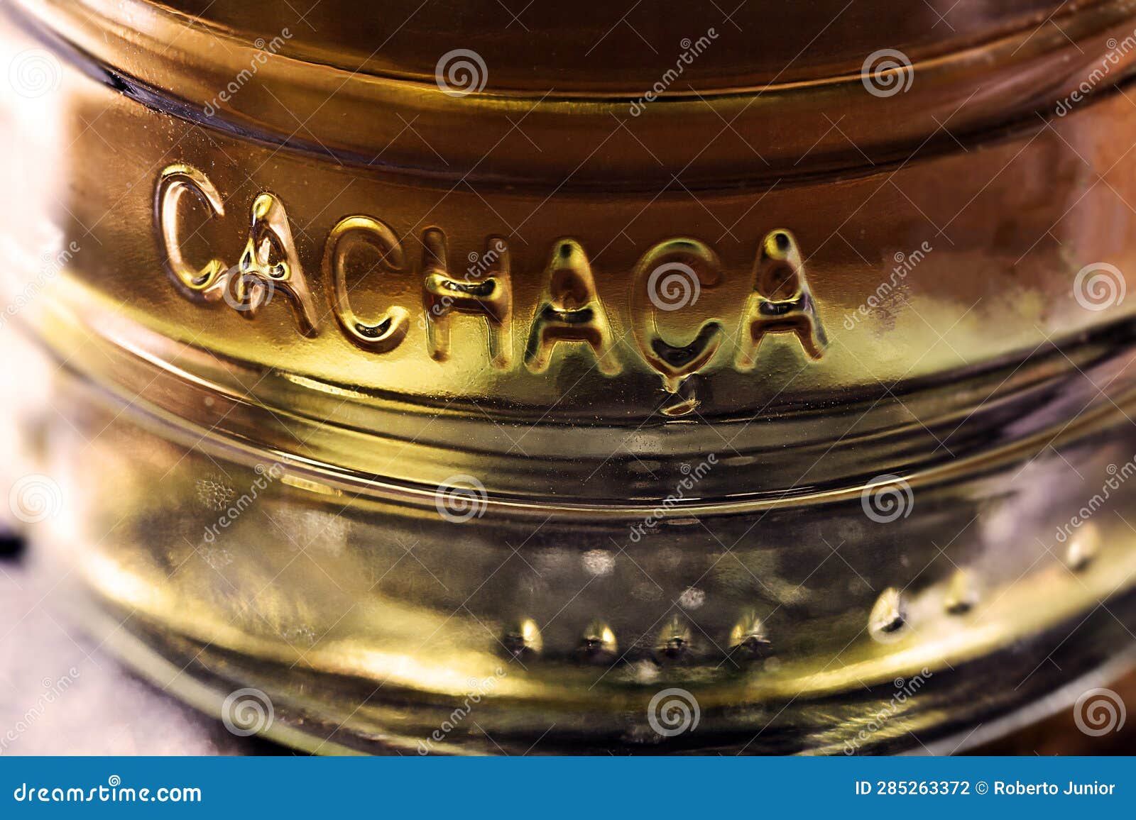 detail of a bottle of cachaÃÂ§a, a typical brazilian drink. brazilian product for export, distilled drink known as aguardente or