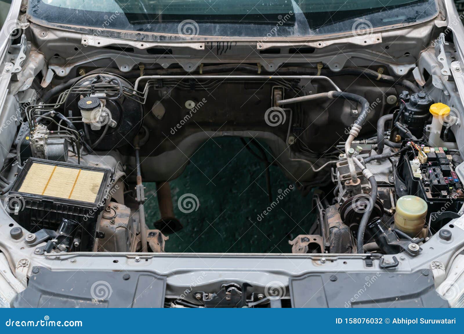 Detail of a Car Engine Room without an Engine Compartment. Stock Photo
