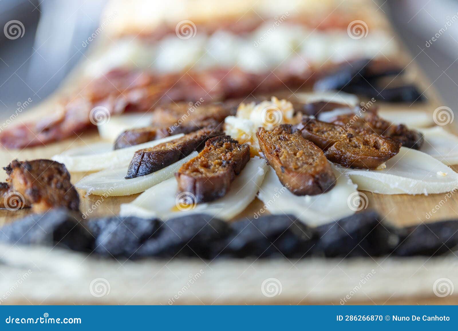 detail of a cheese and chorizo board