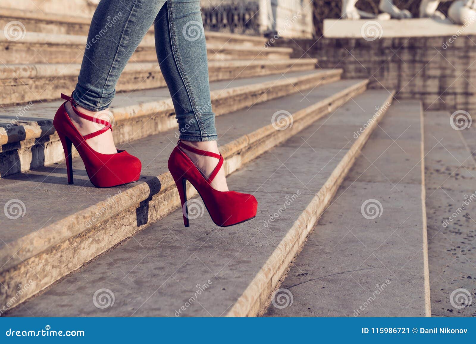 Woman Wearing Blue Jeans and Red High Heel Shoes in Old Town. the Women ...