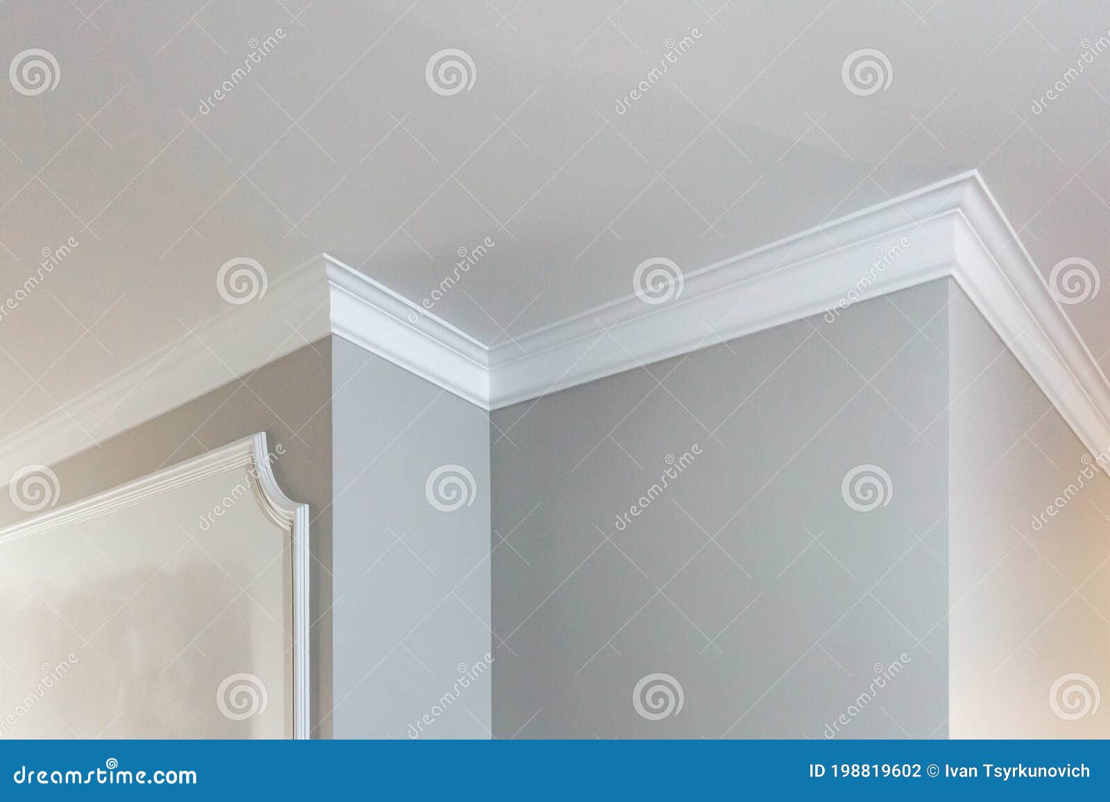 Detail of Corner Ceiling with Intricate Crown Molding Stock Photo