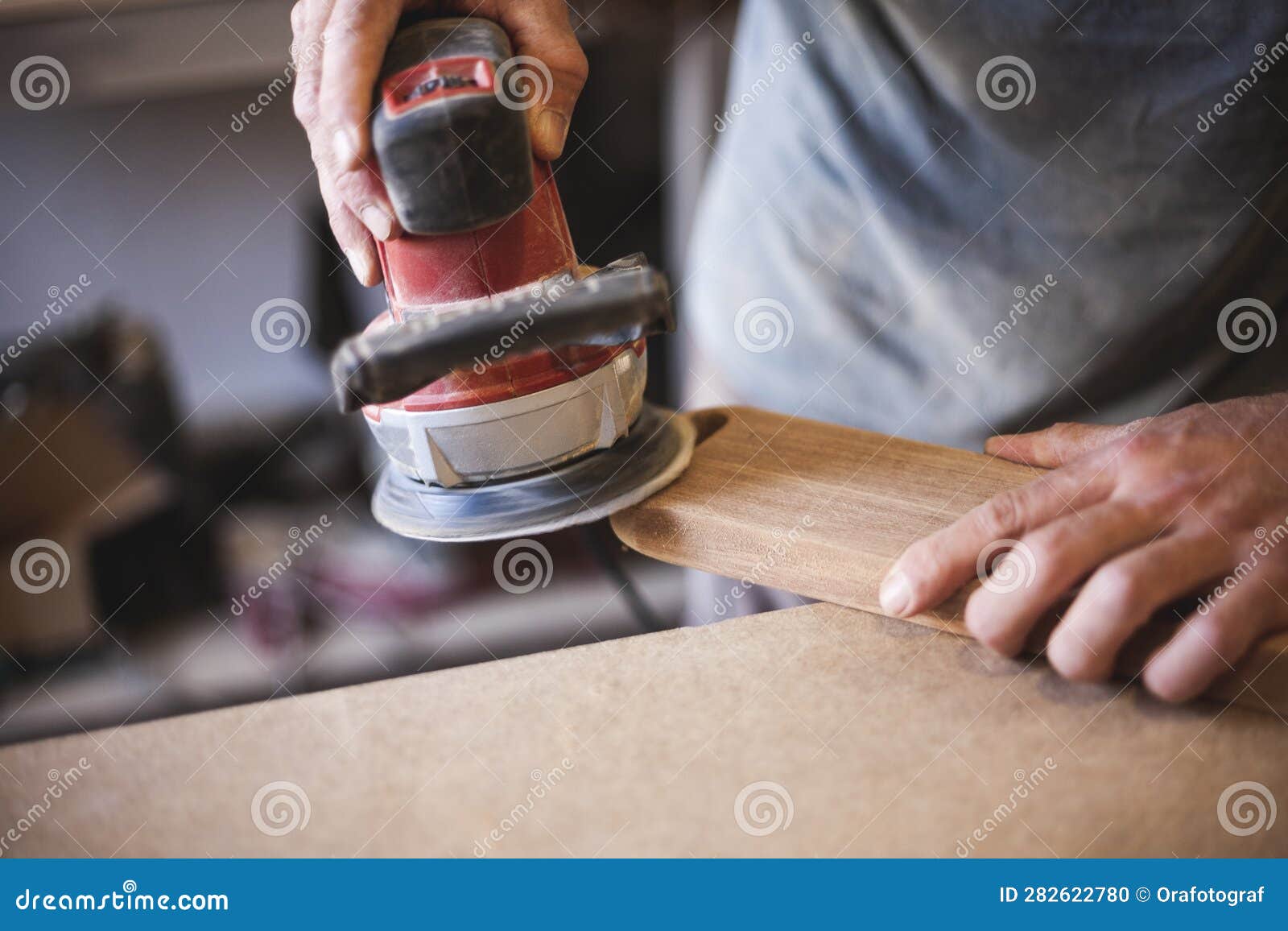 Detail of a Craftsman S Hands Using a Sander Stock Photo Image of