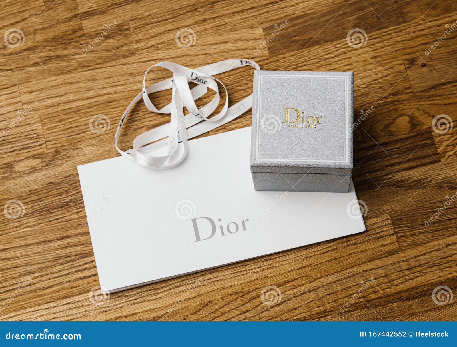 Detail of Dior Silk Wrapping Gift White Band with Logotype and Jewelry