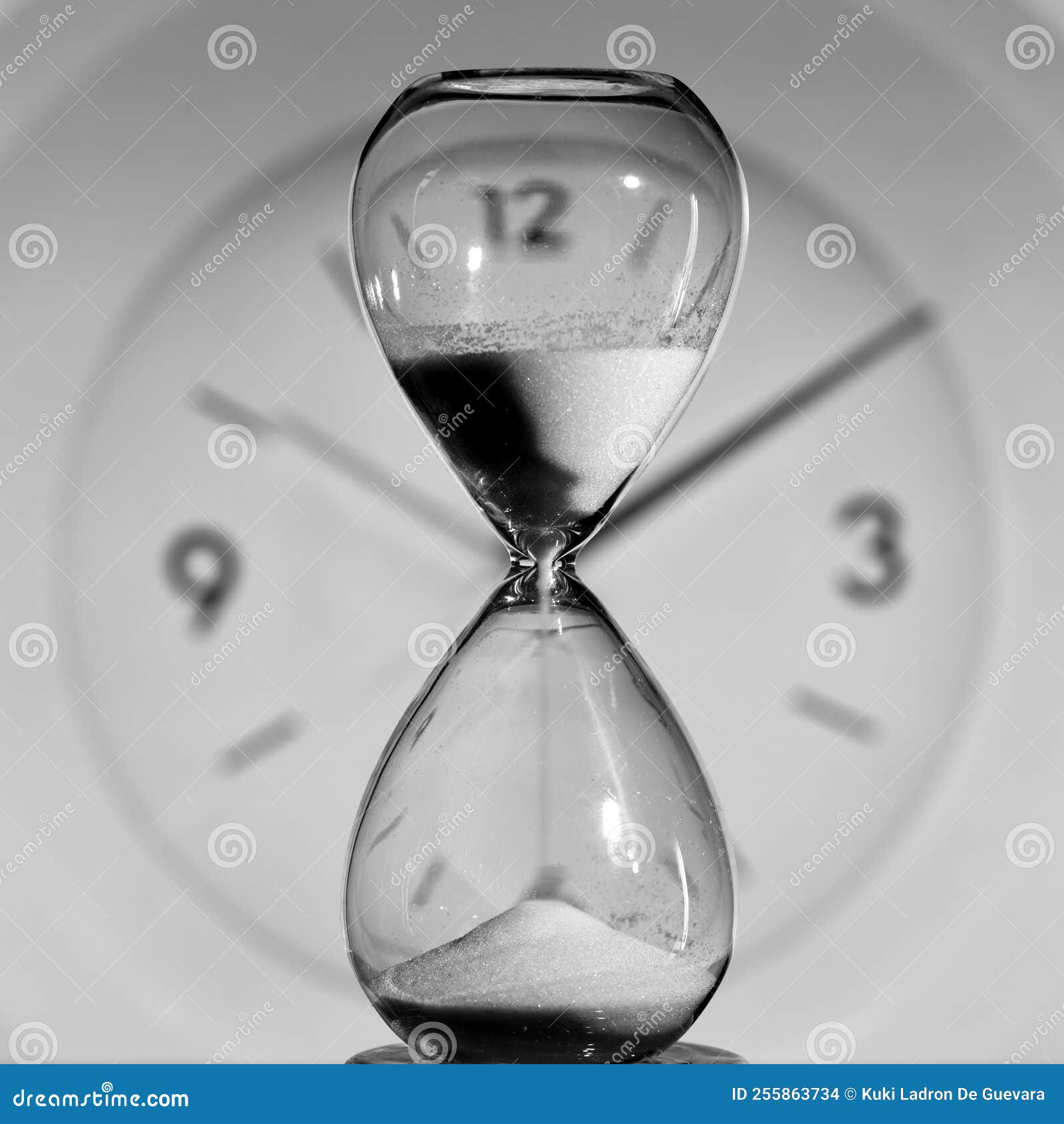 hourglass and round clock measuring time