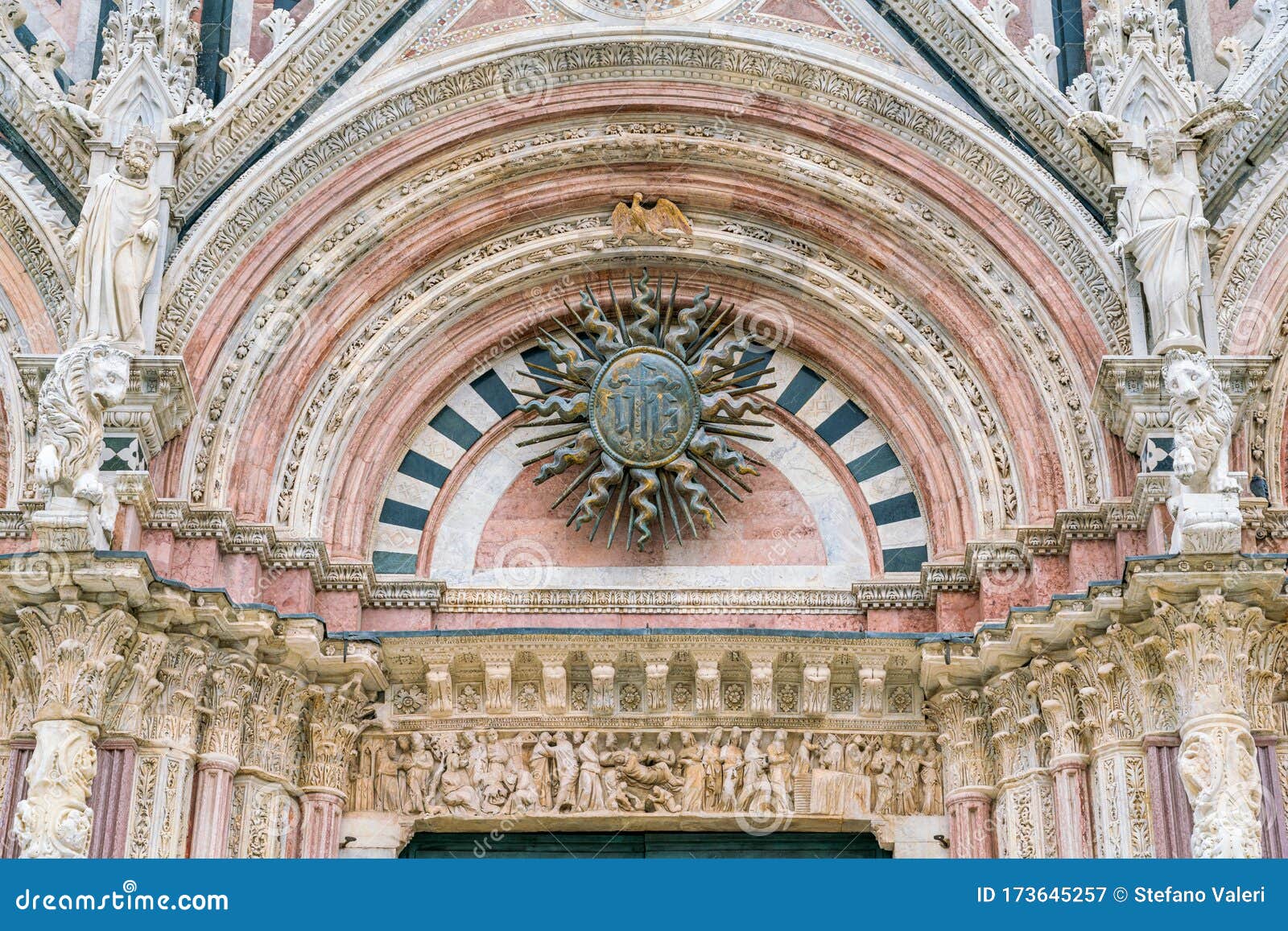 detail from the main facade of the duomo of siena, tuscany, italy.
