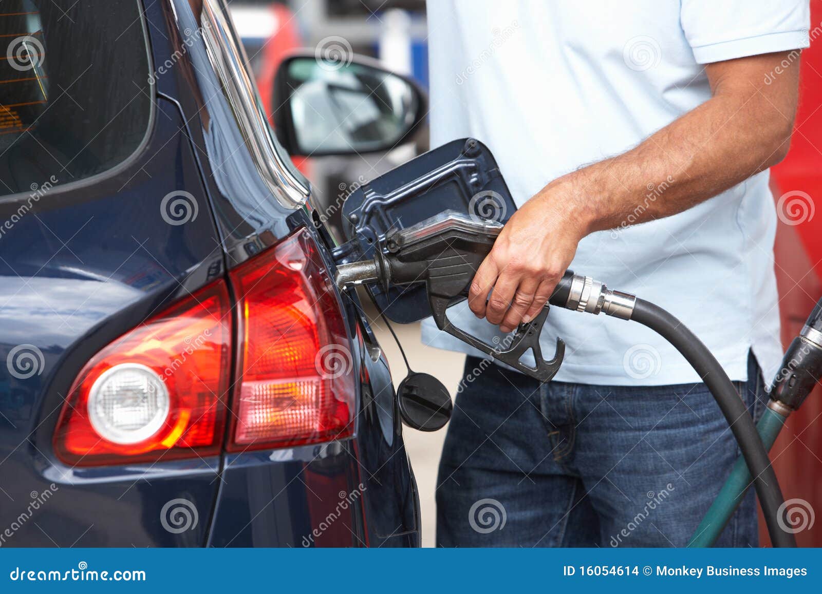 detail of male motorist filling car with diesel