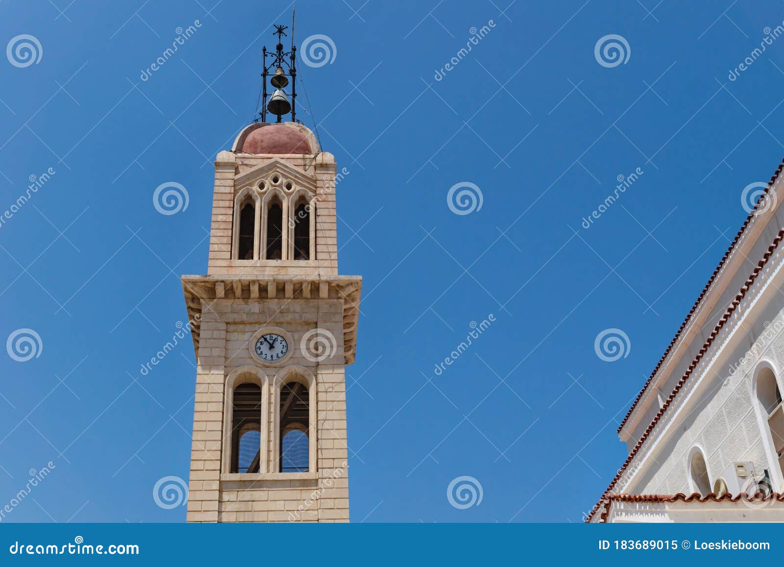 detail of the megalos antonios church bell tower on blue cloudless sky in rethymnon, crete, greece