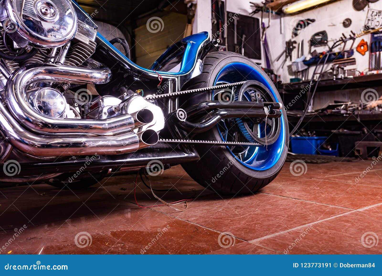 detail on a modern motorcycle in the workshope. motorcycle exhaust. selective focus