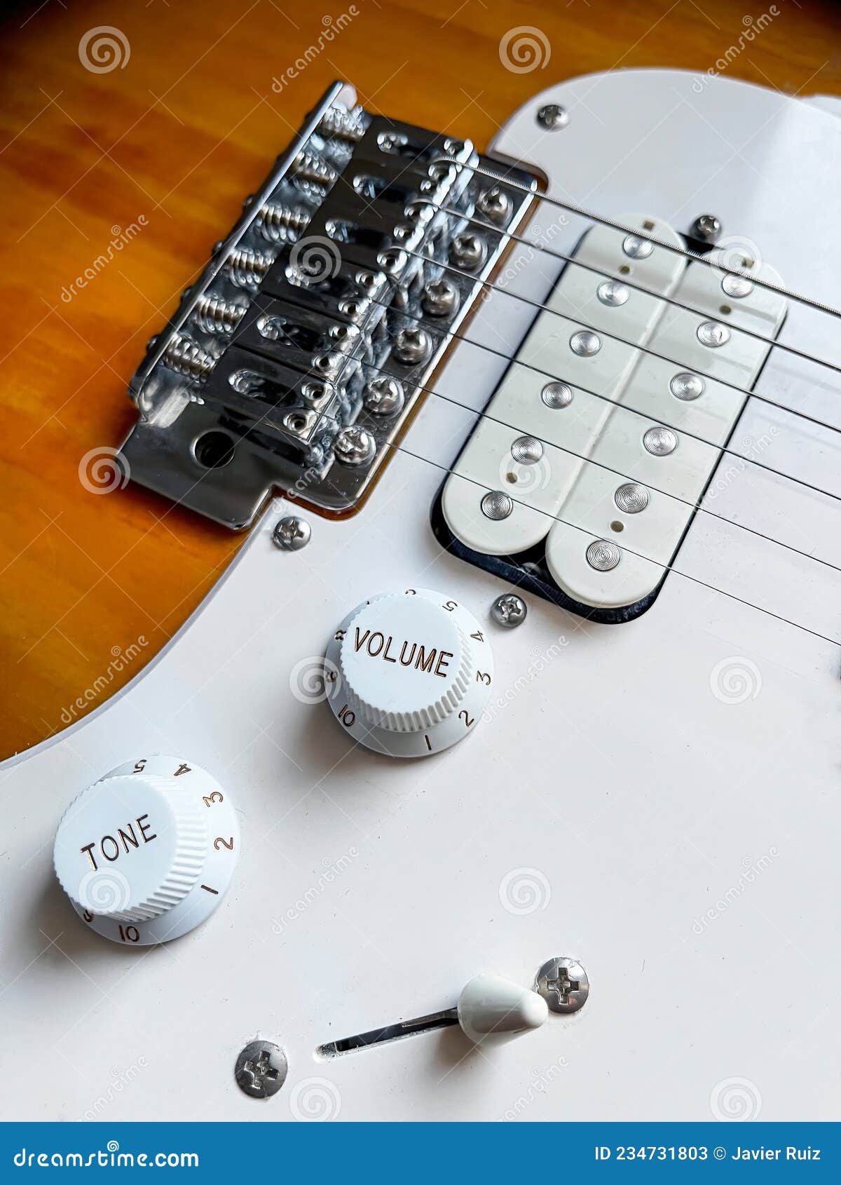 Detail of the Pickups of an Electric Guitar and the Volume and Tone Knobs, Selective Focus Stock