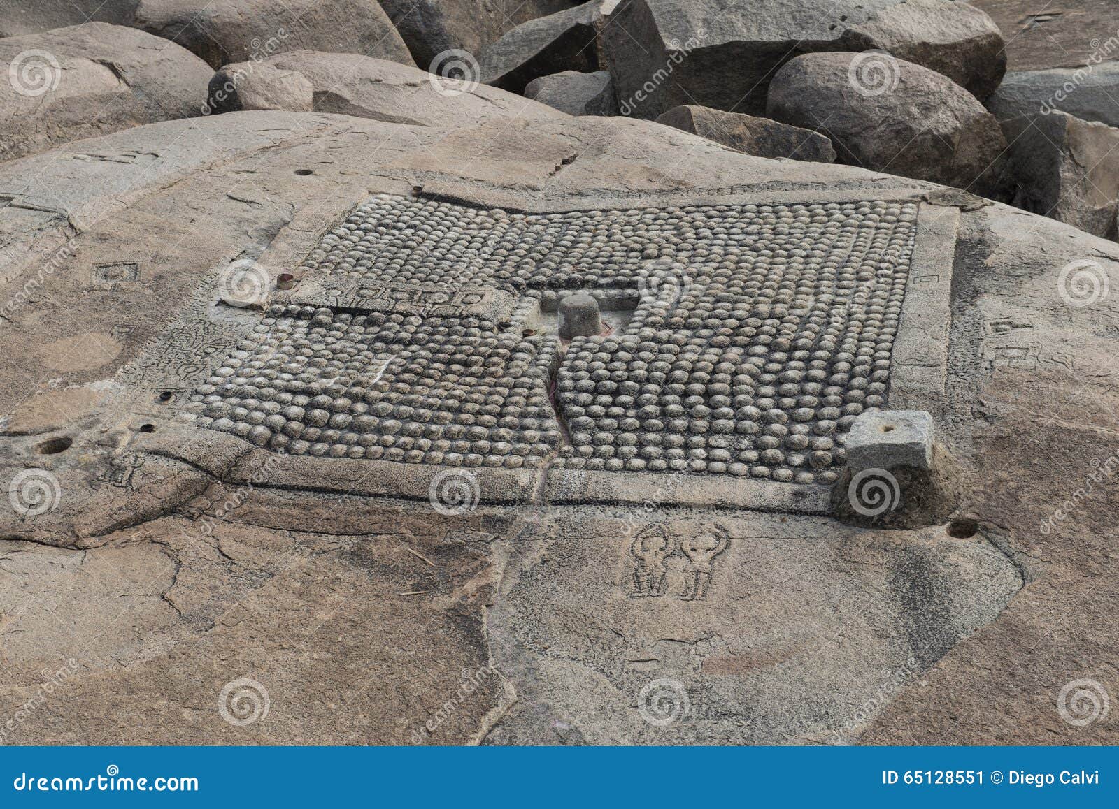 detail of a plant of a temple carved into the rock. hampi, india.