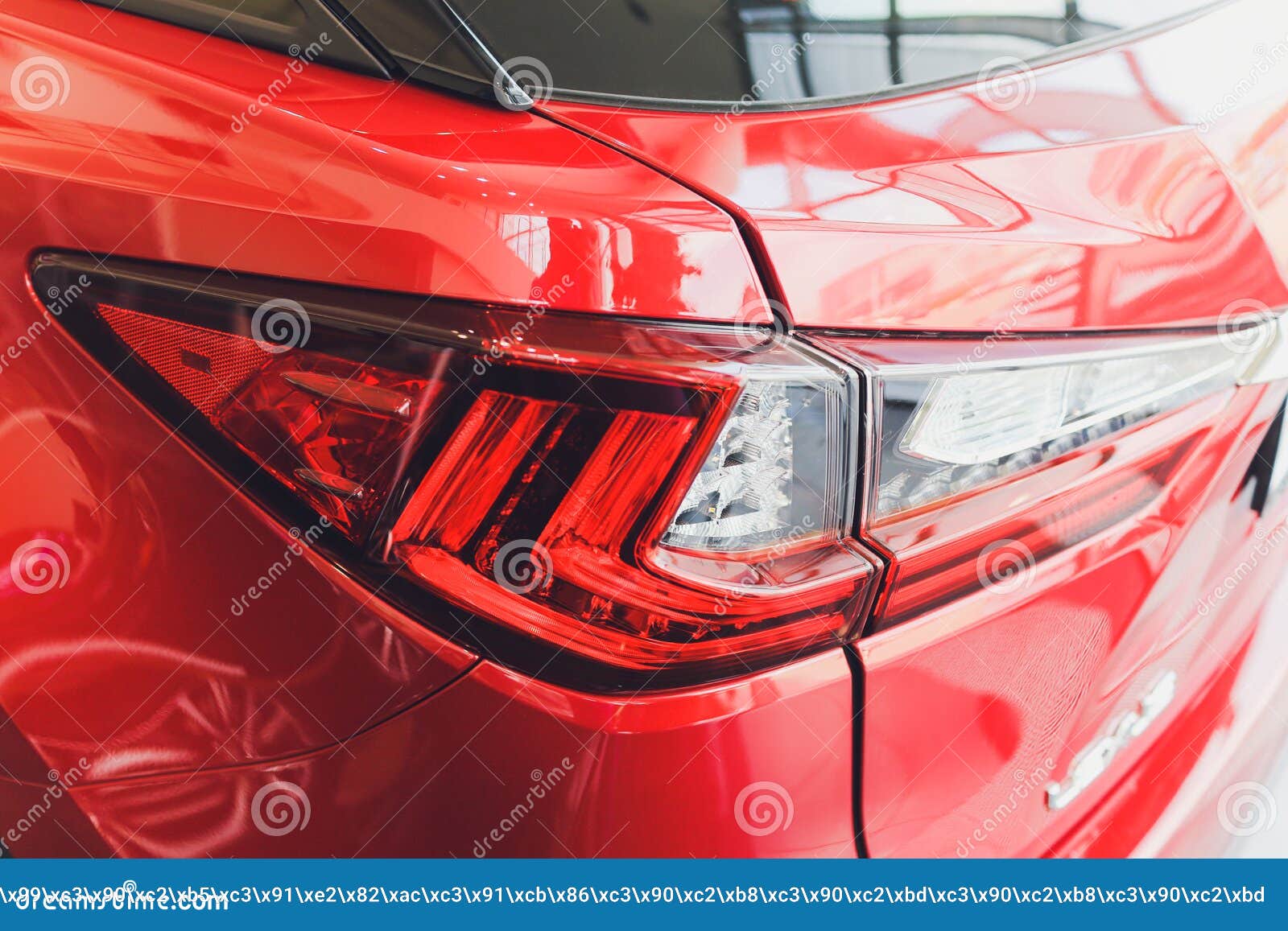 Detail on the Rear Light of a Red Car. Stock Photo Image of blue