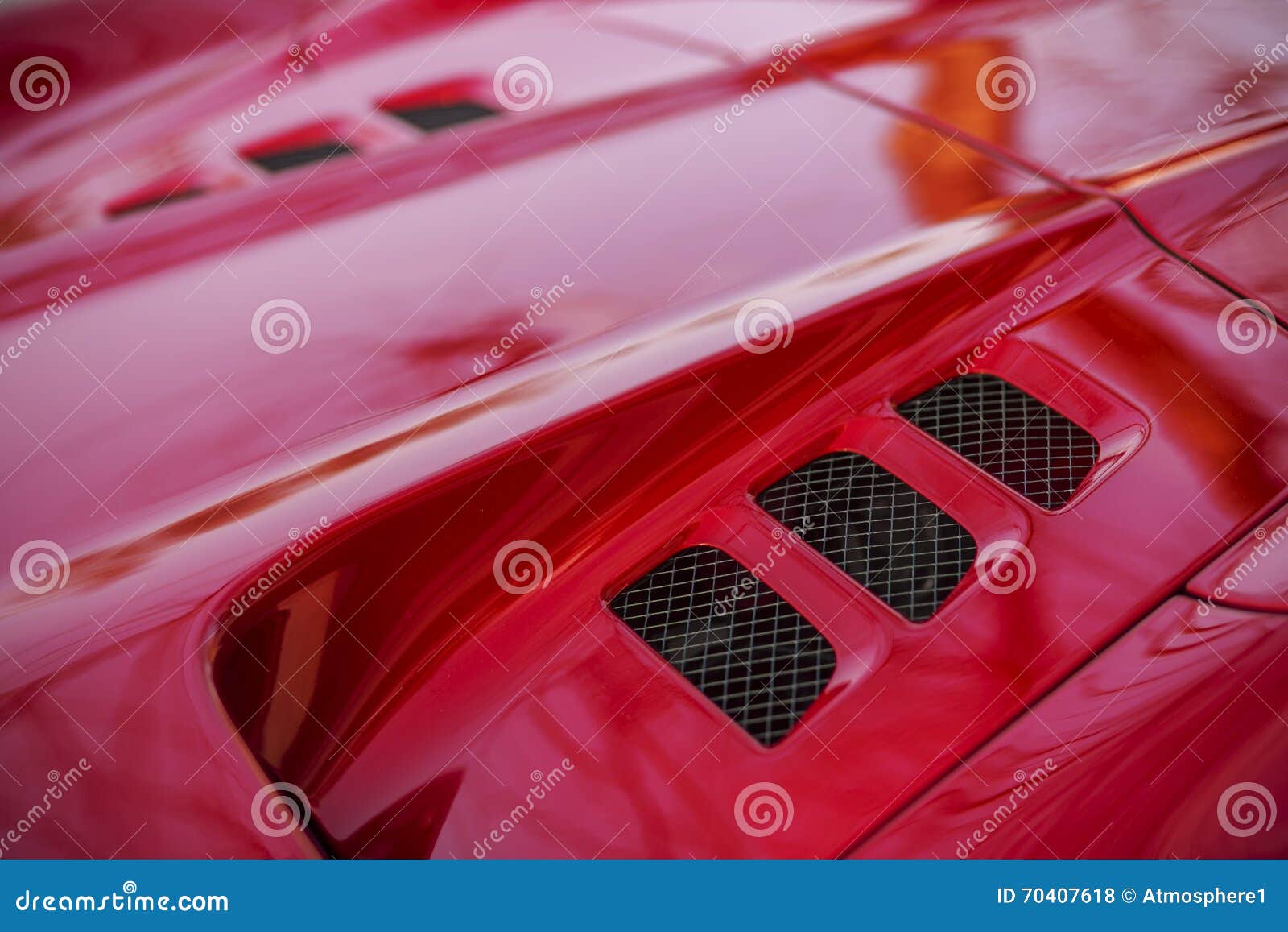 detail of red super-sport car vents on a bonnet