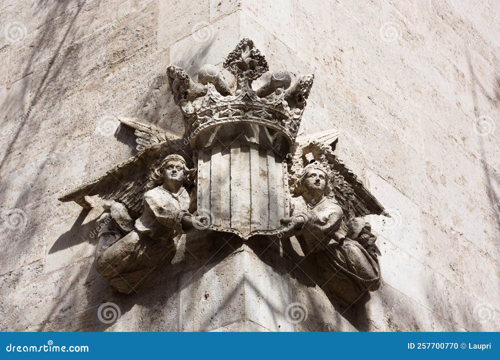 detail of the royal coat of arms of the plaza del mercado on one side of the lonja de la seda in valencia spain
