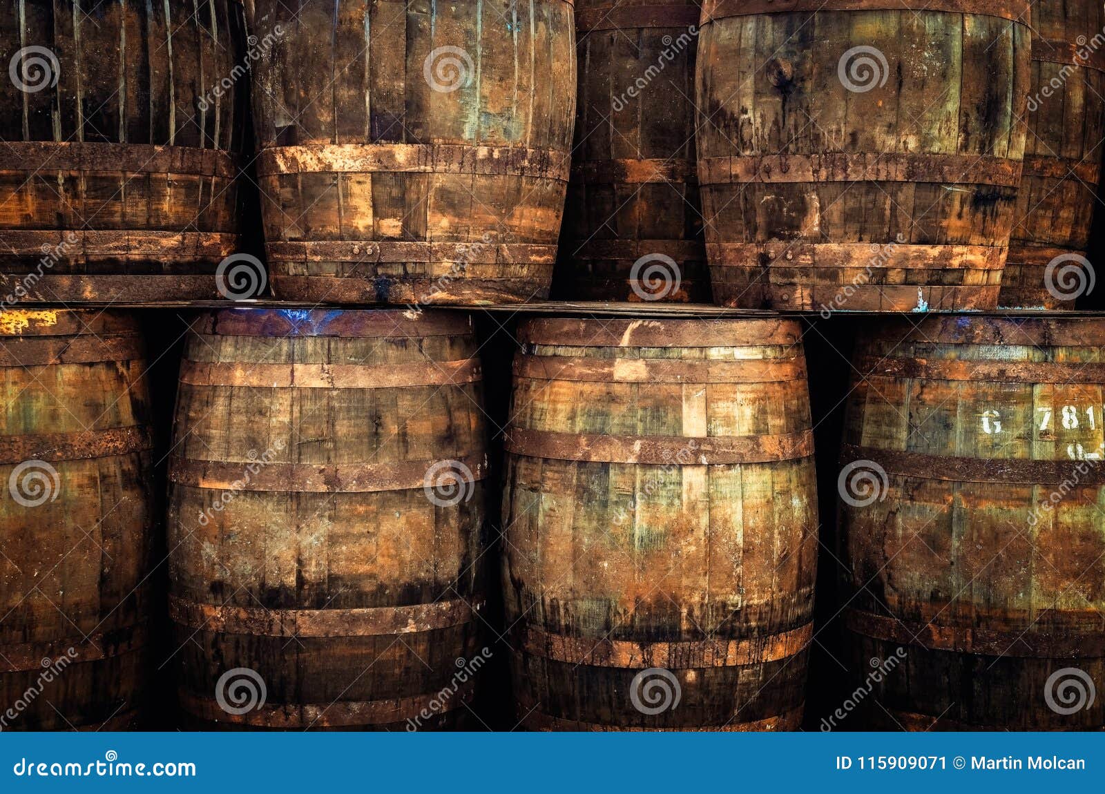 detail of stacked old wooden whisky barrels