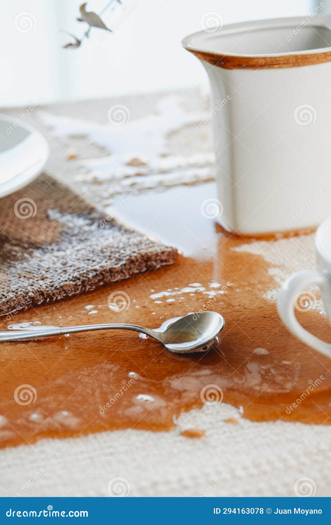 Table with a Puddle of Coffee Spilled Accidentally Stock Photo Image