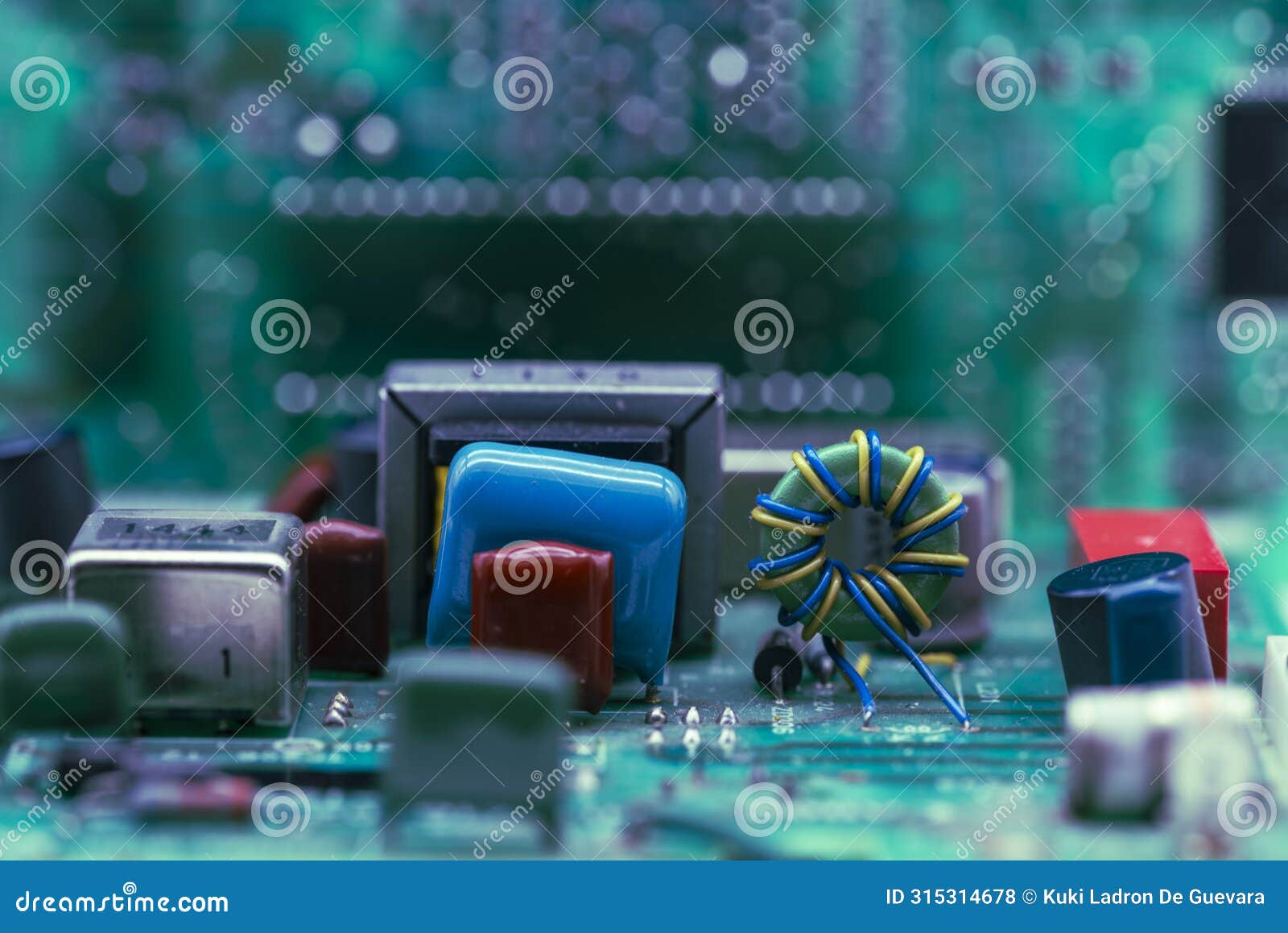 detail of a toroid inductor and electronic components