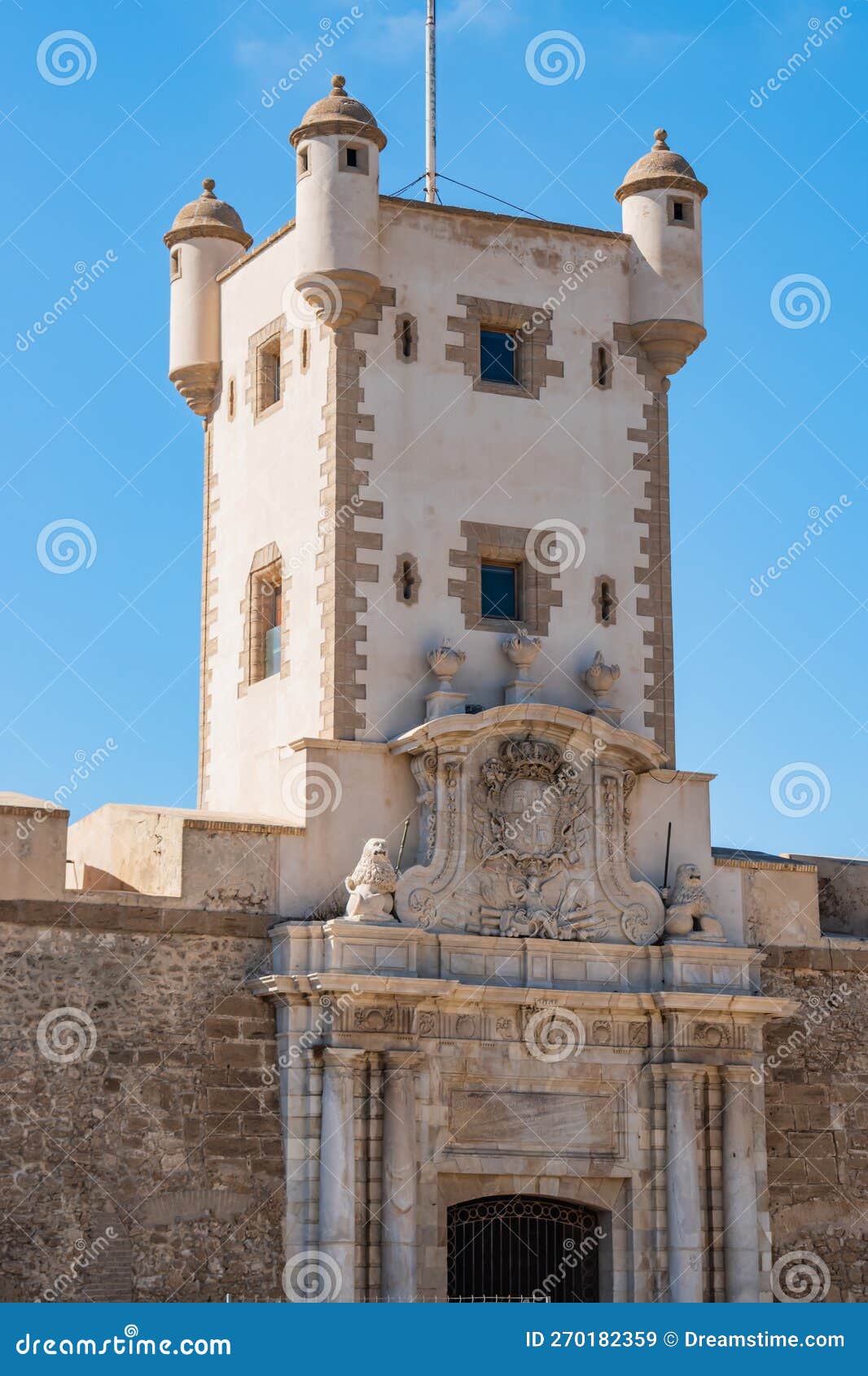 detail of the tower and portal of the puerta de tierra wall that divides the medieval and modern areas of cÃ¡diz, spain