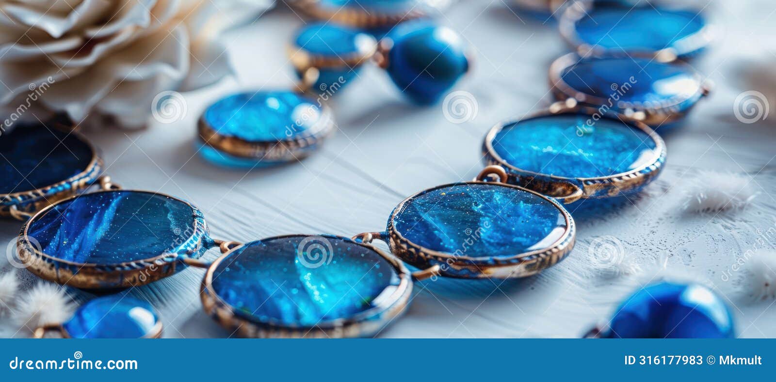 detailed close up of azure and ele necklace on table