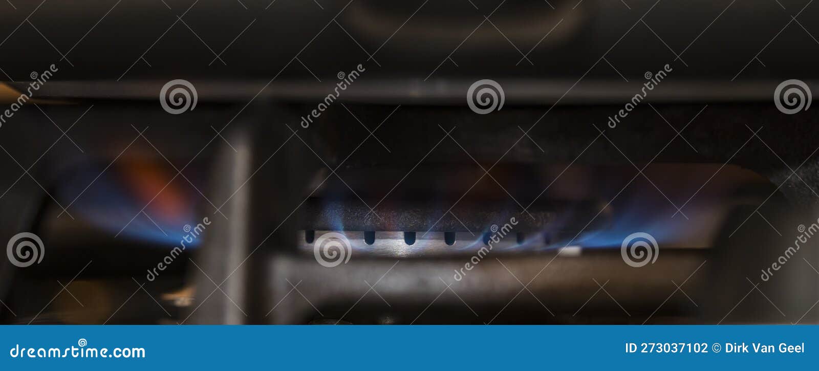 detailed vieuw of gas burning with blue flame on a cooking stove. energy. expensive. sustainability.