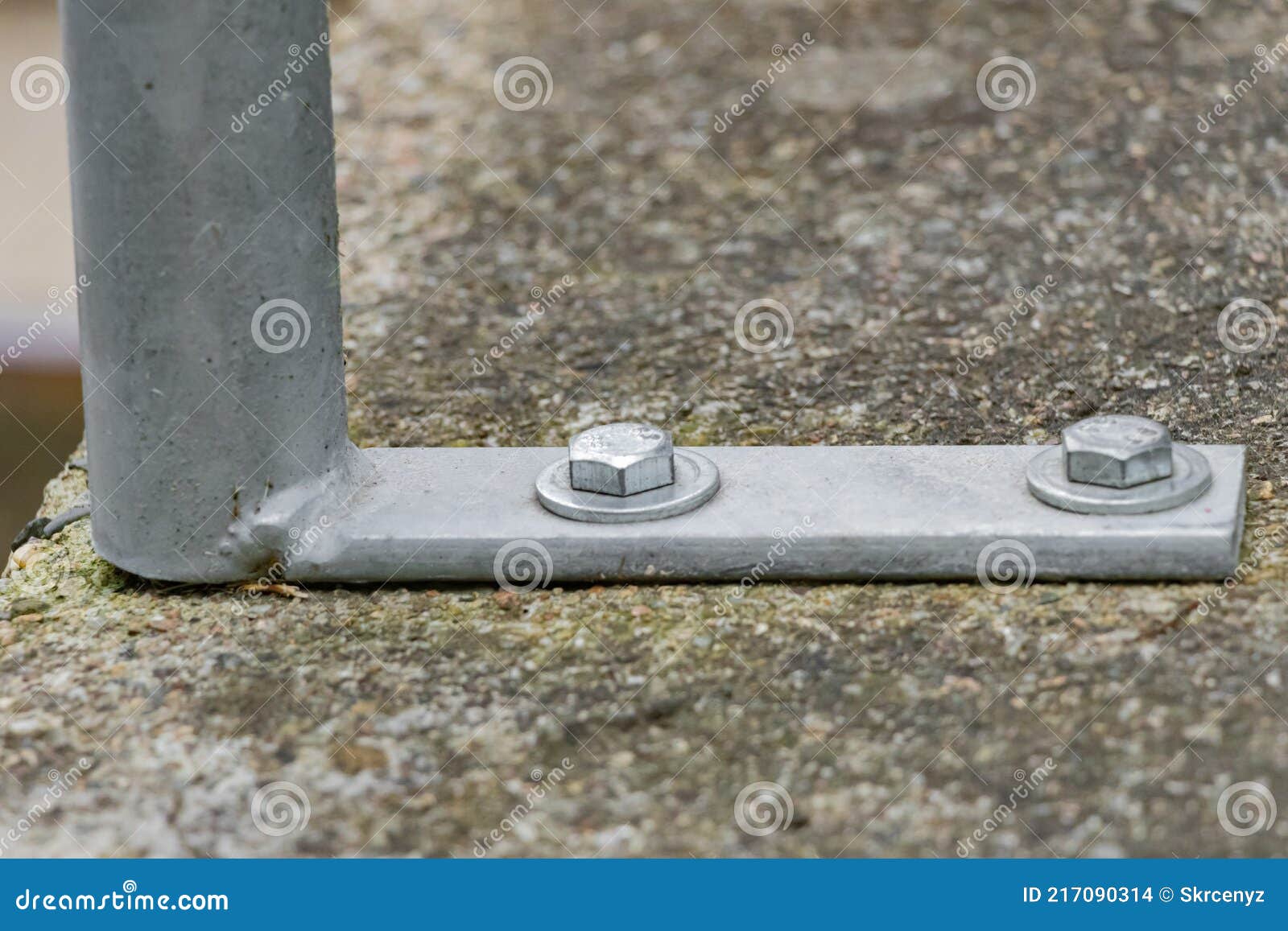 Detailed View of Construction Bolts Bolted To Concrete Foundations