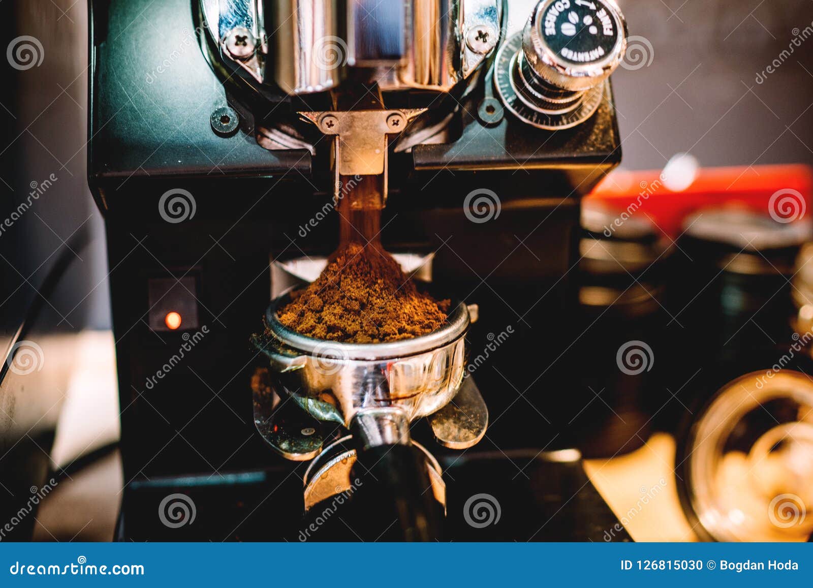 Grinding Coffee, Freshly Grinded Coffee by Barista in Cafe Stock Photo