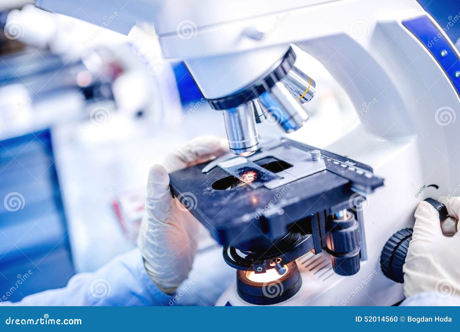 details of medical laboratory, scientist hands using microscope for chemistry test samples