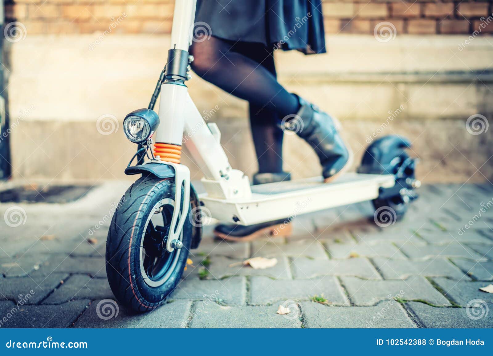 details of modern transportation, electric kick scooter, portrait of girl riding the city transportation