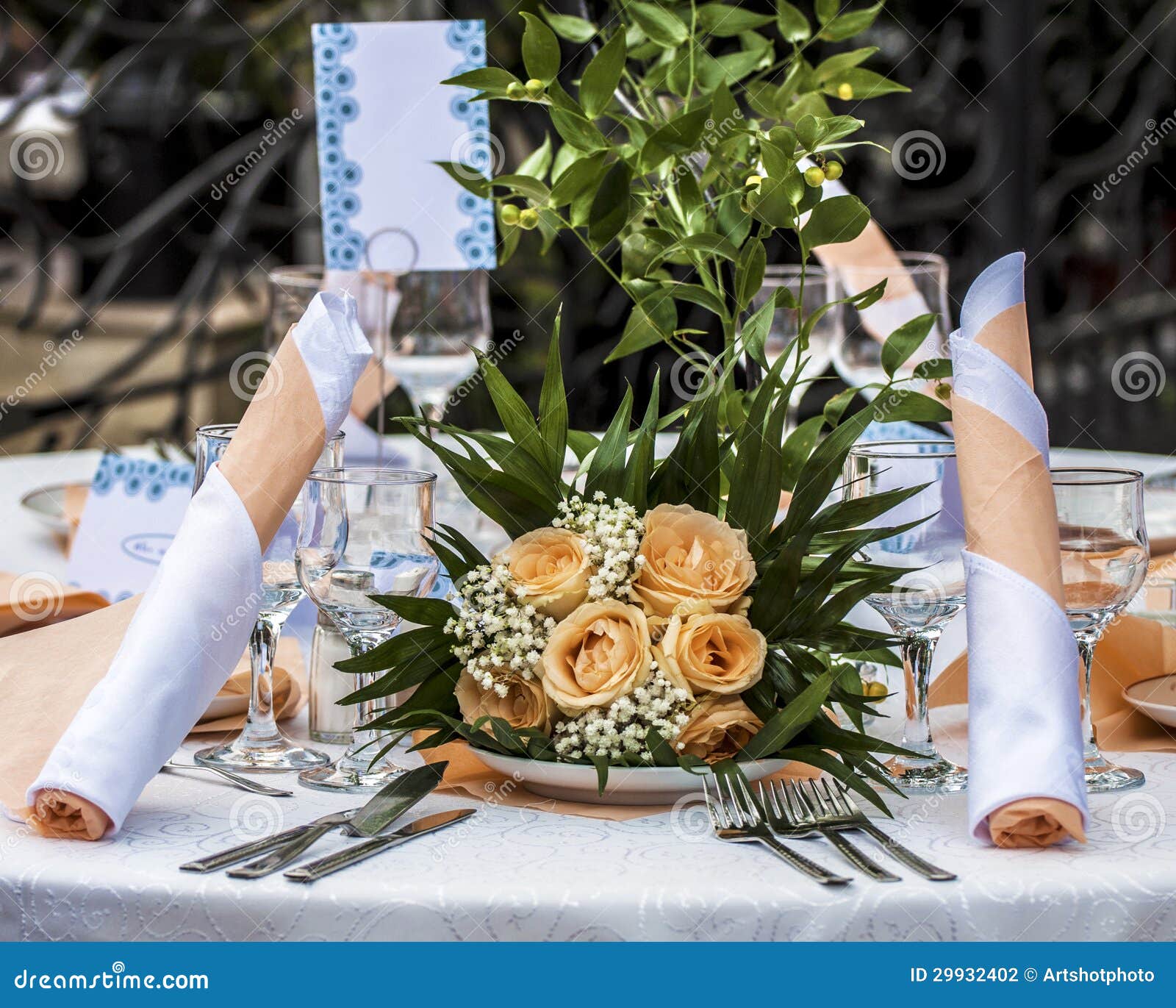 Table Set with Floral Decorations in a Restaurant Stock Photo Image