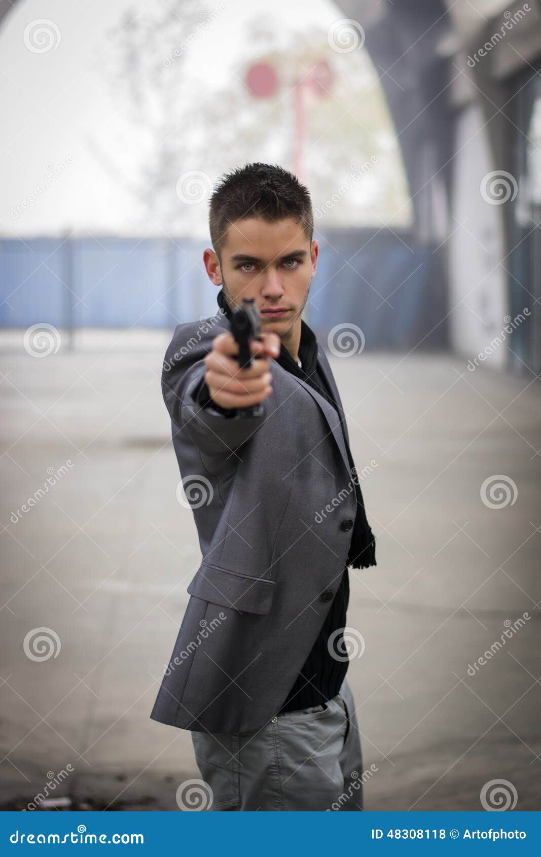 detective or mobster or policeman aiming a firearm