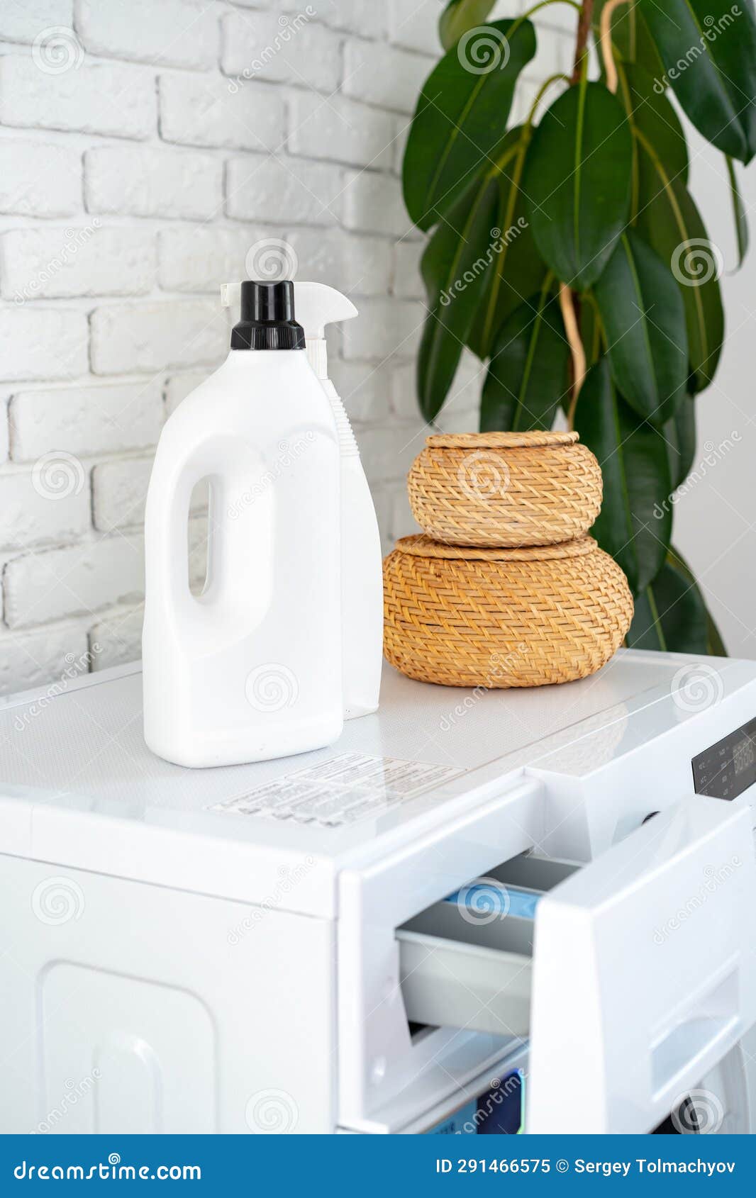 Detergent Bottle on Washing Machine in a Laundry Room Stock Image