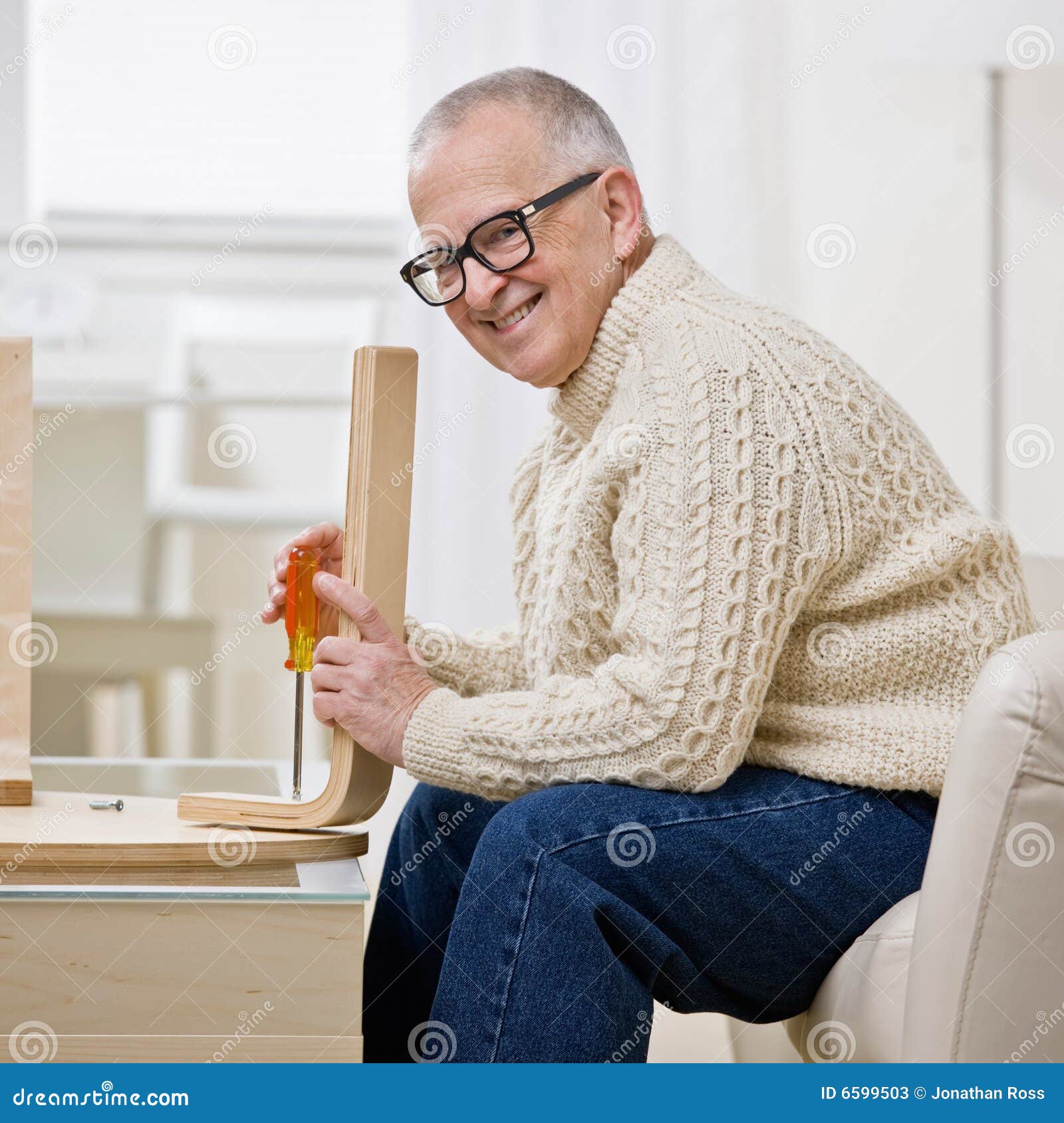 determined man constructing wooden table