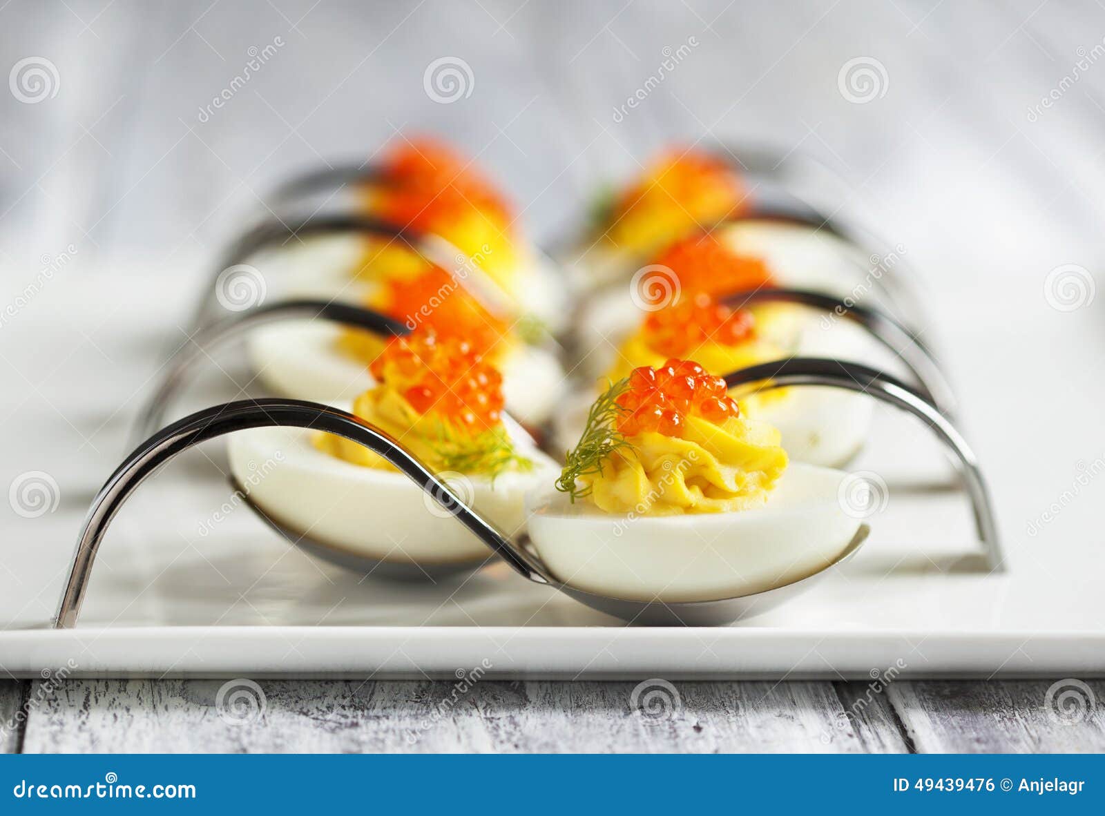 Deviled Eggs with Red Caviar in a Spoon Stock Photo Image of holiday, yellow 49439476