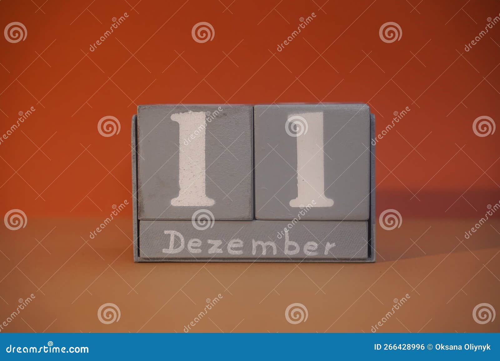 11 dezember on wooden grey cubes. calendar cube date 11 december. concept of date. copy space for text. educational cube