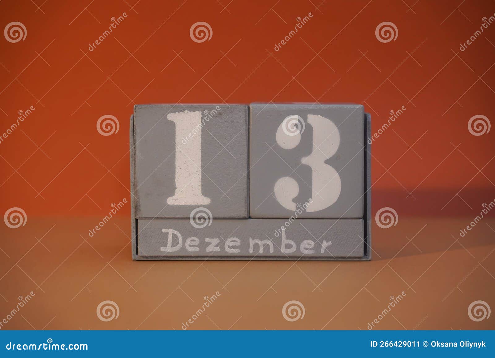 13 dezember on wooden grey cubes. calendar cube date 13 december. concept of date. copy space for text. educational cube