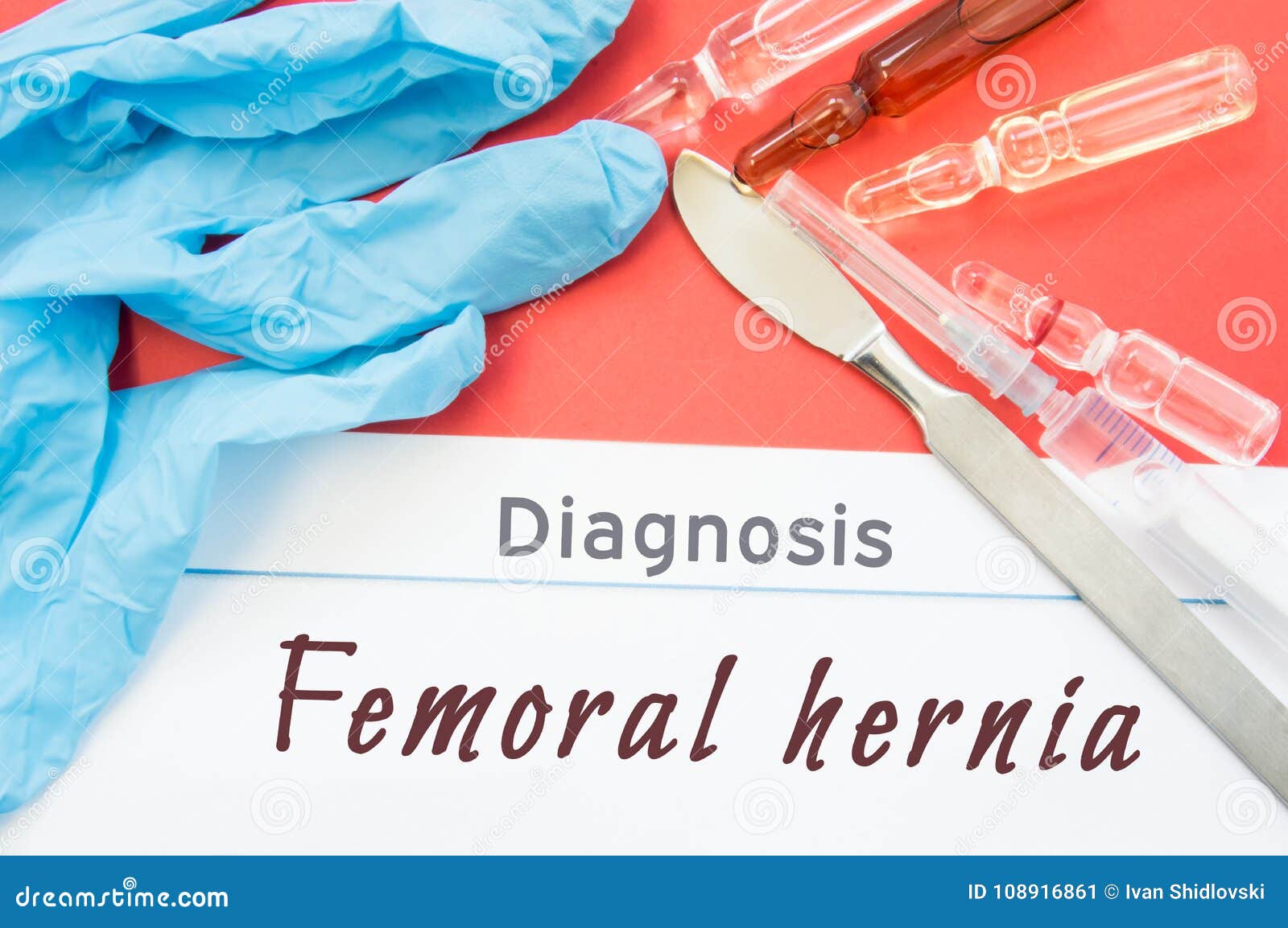 diagnosis femoral hernia. blue gloves, surgical scalpel, syringe and ampoule with medicine lie next to inscription femoral hernia.