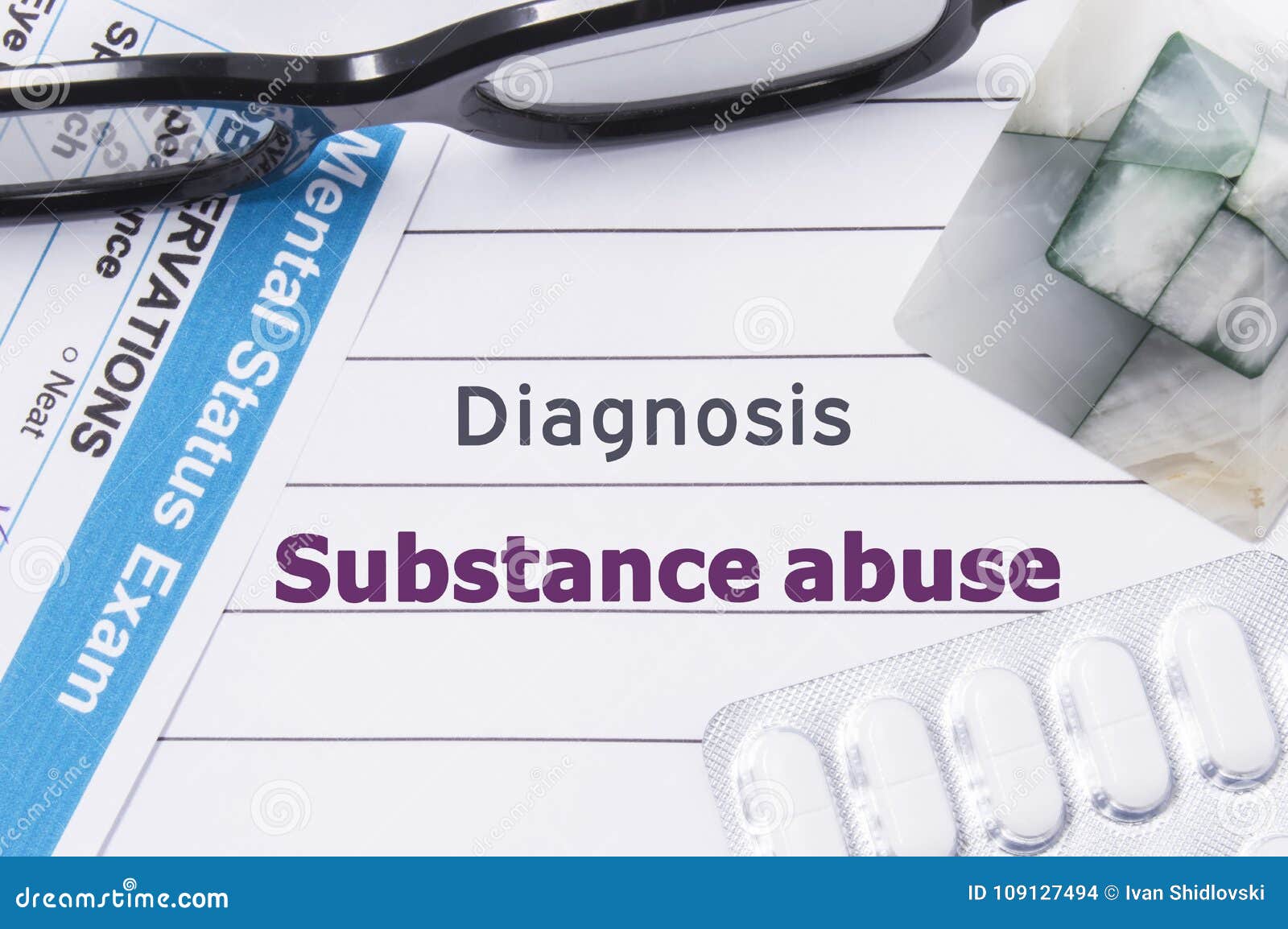 diagnosis substance abuse. medical notebook labeled diagnosis substance abuse, psychiatric mental questionnaire and pills are on t