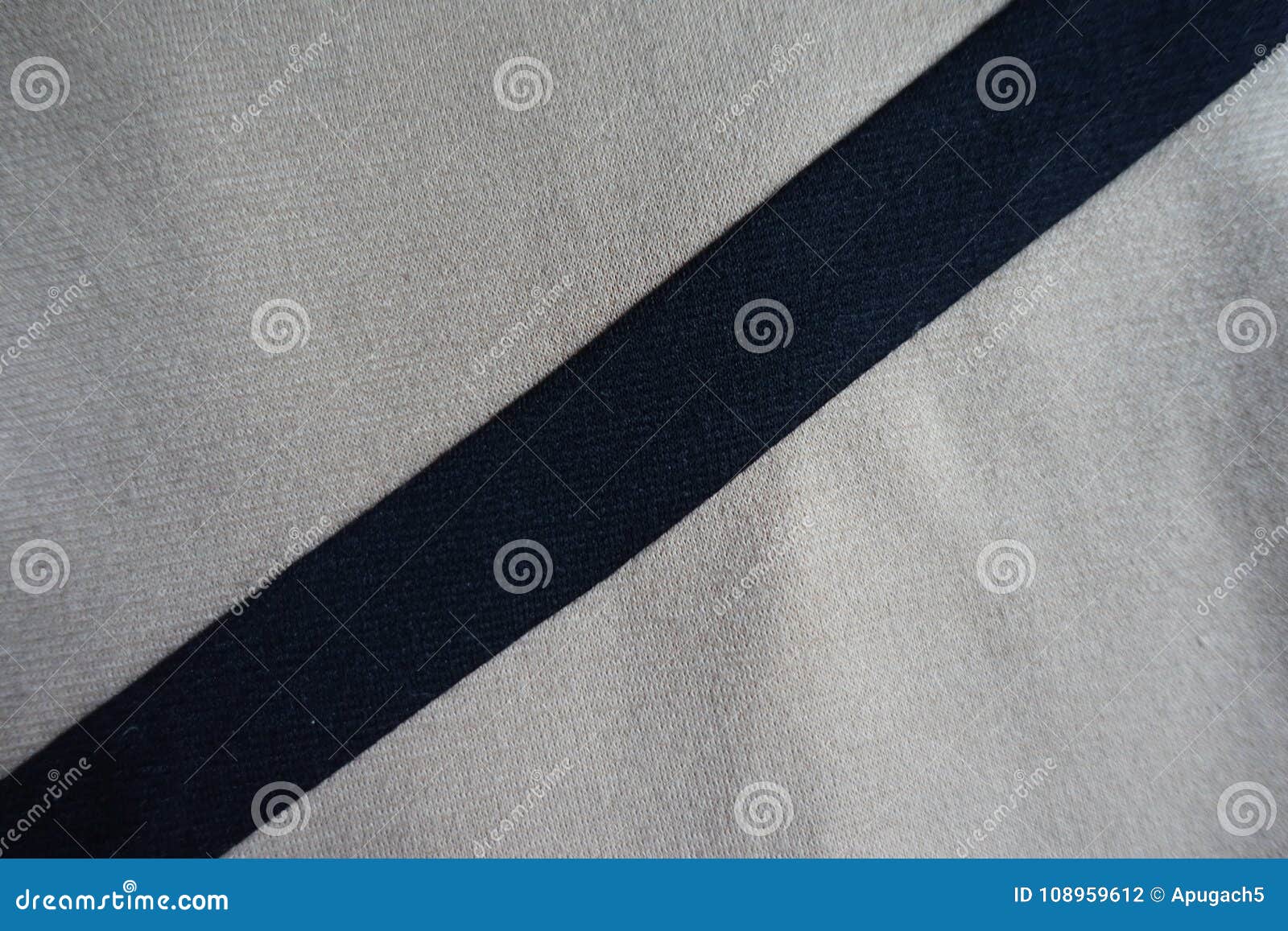 Diagonal Black Ribbon Sewn To Light Grey Fabric Stock Photo - Image of ...