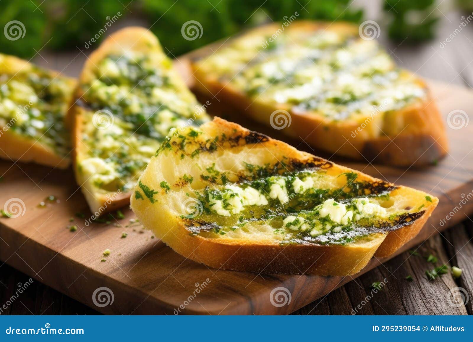 Diagonal Cut of Grilled Bread Smeared with Garlic Herb Butter Stock