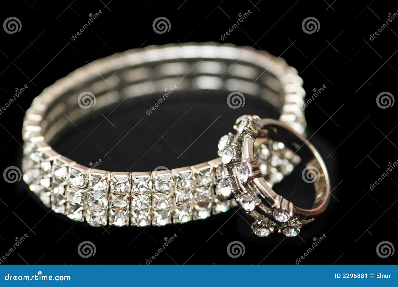 Diamond bracelet and ring isolated on black